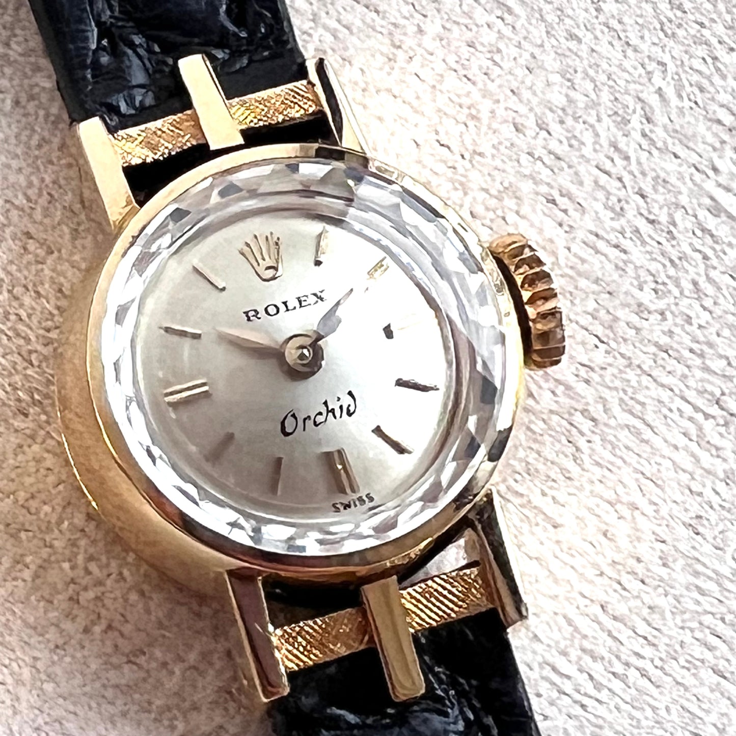 Rolex Orchid 18k, etched lugs w/ black strap