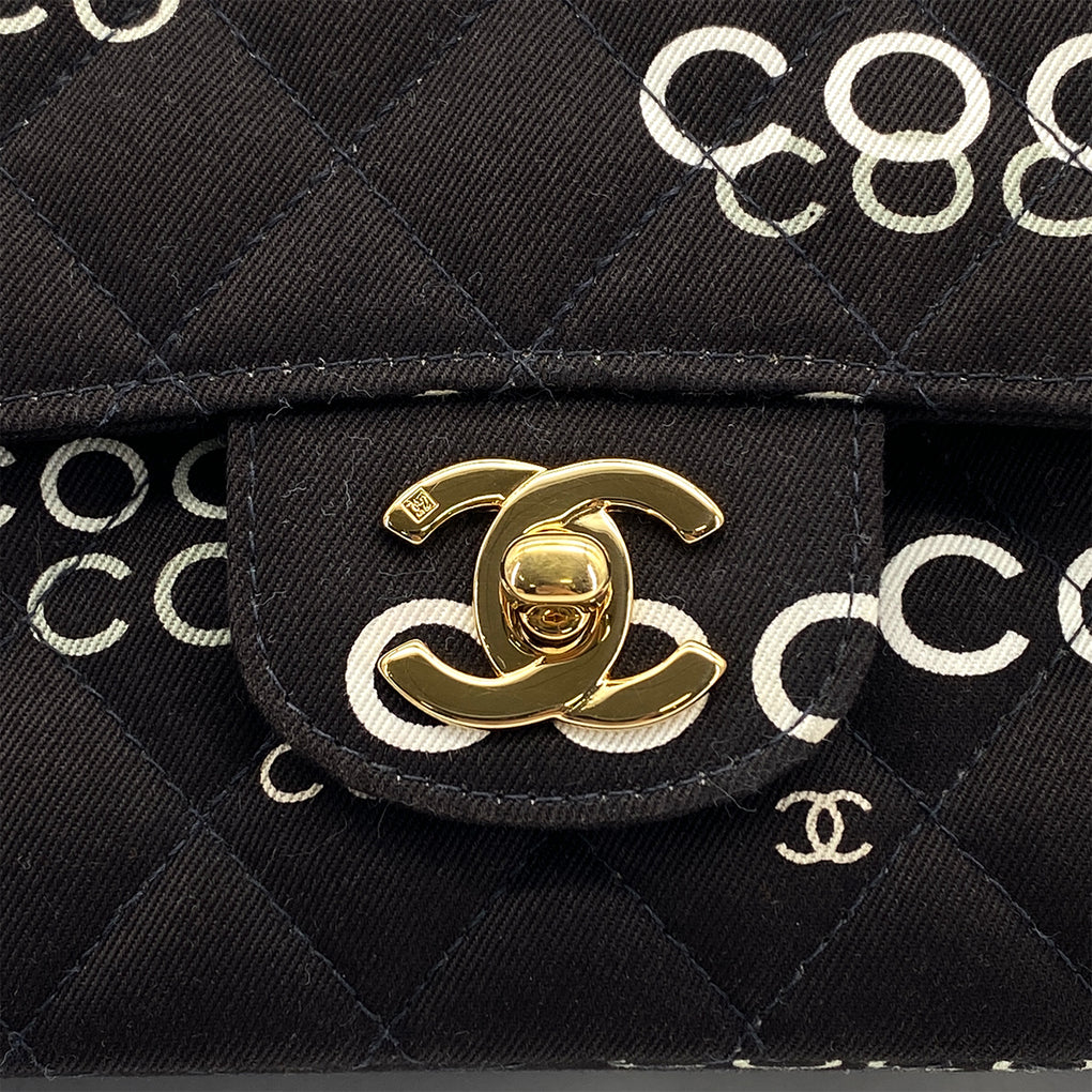 Evienne, 7 Series Coco Print Black Canvas Gold  Hardware with seal and card